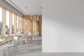 White and wooden office canteen interior with blank wall Royalty Free Stock Photo