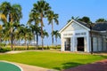White wooden open pavilion in Thailand resort among green palm trees and lawns. Wooden house Royalty Free Stock Photo