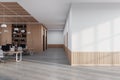 White and wooden open space office with blank wall Royalty Free Stock Photo