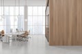 White and wooden open space office with blank wall Royalty Free Stock Photo