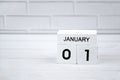 White wooden perpetual calendar showing the 1st of January. Royalty Free Stock Photo