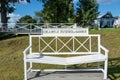 White wooden `Reconciliation Bench` in the park `Love and Fidelity`. Historically restored park, in the style of the 19th century,