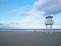 White wooden safe house at beach with cloudy sky