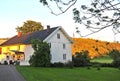 White wooden scandinavian house on sunset