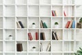 White wooden shelves with old books. Wooden bookcase. Royalty Free Stock Photo