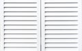 White wooden shutters to protect windows from sunlight Royalty Free Stock Photo