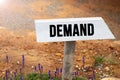 White wooden signpost with the word demand Royalty Free Stock Photo