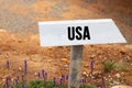 White wooden signpost with the word usa