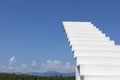 A white wooden staircase or ladder leading to a blue sky Royalty Free Stock Photo