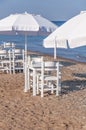 White wooden table on beach with blue sea with two chair Royalty Free Stock Photo