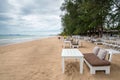 White wooden table set on beach Royalty Free Stock Photo