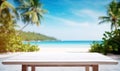 White Wooden Table Top And Blur Tropical Beach Of The Blur Exterior Background Royalty Free Stock Photo
