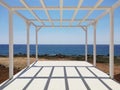 White wooden terrace construction on the coast of the sea