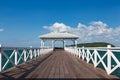 White wooden walkway leading to seacoast skyline Royalty Free Stock Photo
