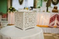 White wooden wedding box for gifts.