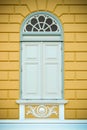 White wooden window antique style on yellow wall