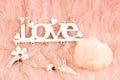 White wooden word love and fluffy ball Royalty Free Stock Photo