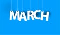 White word MARCH - word hanging on the ropes on blue background. Royalty Free Stock Photo