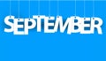 White word SEPTEMBER - word hanging on the ropes on blue background. Royalty Free Stock Photo
