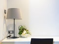 White working desk with table lamp, bedroom interior