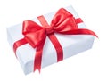 White wrapped present box with red ribbon isolated on white Royalty Free Stock Photo