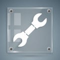 White Wrench spanner icon isolated on grey background. Square glass panels. Vector Illustration