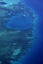 White yacht coral reef in beautiful bay sea. Aerial view. Royalty Free Stock Photo