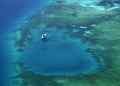 White yacht coral reef in beautiful bay sea. Aerial view. Royalty Free Stock Photo