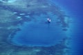 White yacht coral reef in beautiful bay sea. Aerial view. Royalty Free Stock Photo