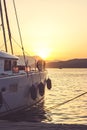 White yacht docked in sea port at beautiful sunset; summertime background with copy space Royalty Free Stock Photo