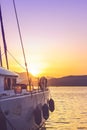 White yacht docked in sea port at beautiful sunset; summertime background with copy space Royalty Free Stock Photo