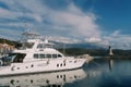 White yacht moored in Lustica Bay overlooking the lighthouse. Montenegro