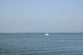 White yacht sail in sea on the background blue sky. Royalty Free Stock Photo