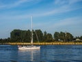 White yacht or sailboat entering harbor