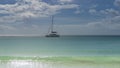 A white yacht is sailing in a calm boundless turquoise ocean Royalty Free Stock Photo