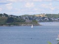 A white yacht sailing in front of the roadstead of St Mawes on the Roseland Peninsula near Falmouth Royalty Free Stock Photo