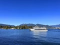 The white yacht sails slowly from right to left calm no wind Clear blue sky and smooth ocean water in the background Royalty Free Stock Photo