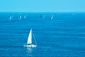 White yachts sailing at sea