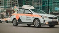 White Yandex taxi car on Moscow streets