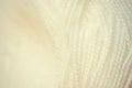 White yarn close-up shot. Woolen threads for knitting a macro. Fabric background texture. Royalty Free Stock Photo