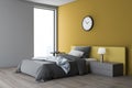 White and yellow bedroom corner with clock Royalty Free Stock Photo