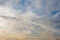 White and yellow clouds float across the sky, Cirrus clouds, the sun is approaching sunset. Fast-forward, time lapse. Royalty Free Stock Photo