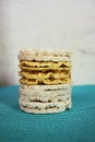 White rice crackers on blue background. Royalty Free Stock Photo