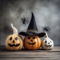 White and yellow ghost pumpkins with witch hat
