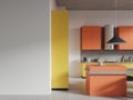 White, yellow and orange kitchen with island and blank wall Royalty Free Stock Photo