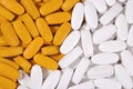 White and yellow pills background Royalty Free Stock Photo