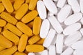 White and yellow pills background Royalty Free Stock Photo