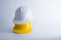 White and yellow safety helmet on white background. Hard hat and Royalty Free Stock Photo