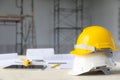 White and yellow safety helmet in construction site Royalty Free Stock Photo