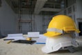 White and yellow safety helmet in construction site Royalty Free Stock Photo